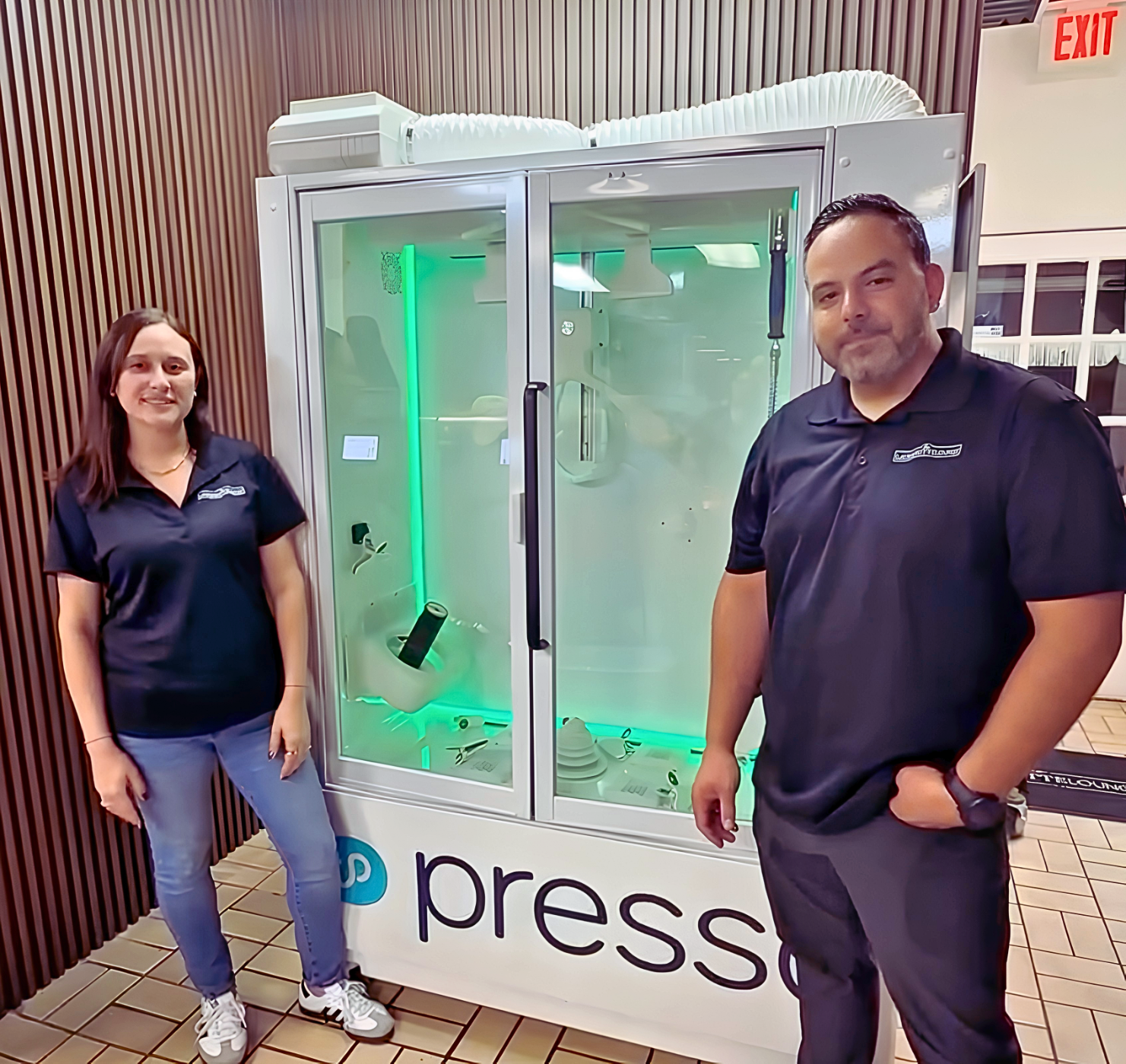The Launderette Lounge team with the Presso dry cleaning machine